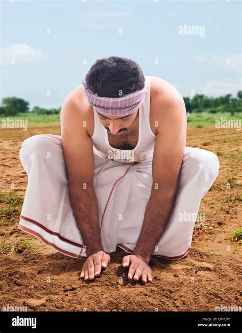 farmer sowing  seed   field stock photo alamy