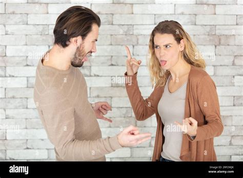 couple pulling faces  gesturing    stock photo alamy