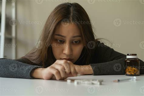 Anti drugs, drug addict asian young woman hand holding pills