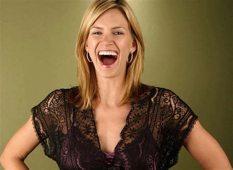Download Natasha Henstridge posing for a photoshoot Wallpaper