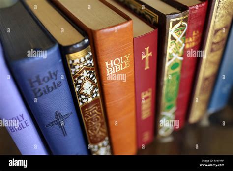 Stack of holy books : Bible and Quran. Christianity and Islam Stock Photo - Alamy