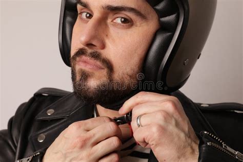 Cropped Portrait of Bearded Biker in Leather Jacket Fasten a Motorcycle ...