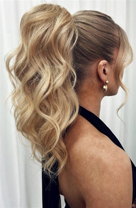 textured high ponytail  loose waves glam hairstyle  parties