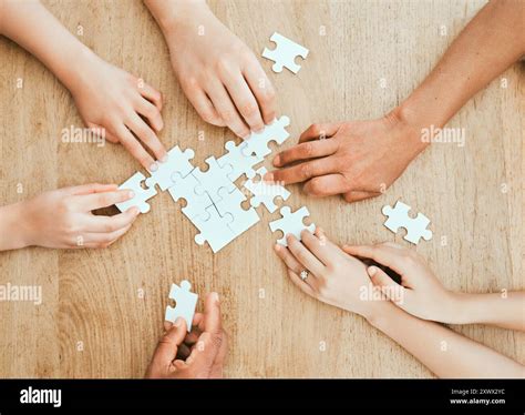 hands puzzle  teamwork  group  people  wooden table