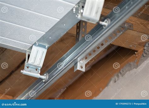 how to install garage door rollers