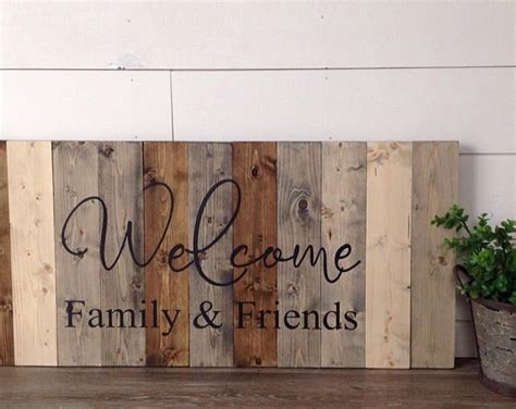 a wooden sign that says welcome family and friends on the side of a ...