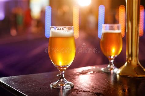 glass  cold beer   wooden table   bar stock photo image