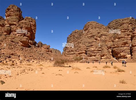 Hikers, group of people hiking in a canyon, Tassili n'Ajjer National ...