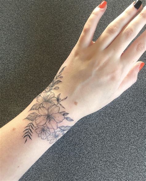 Flower Tattoo Designs For The Wrist at Marsha Shain blog
