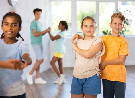 Light-skinned Boy and Girl Dance in Pairs and Rehearse Dance before ...
