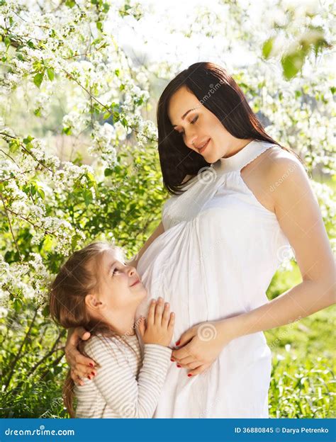 Happy Pregnant Mother and Her Little Daughter Stock Image - Image of