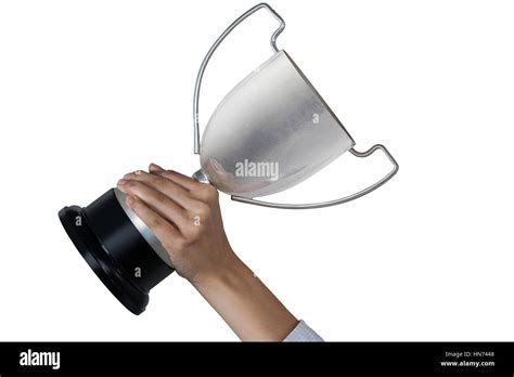 Females hands holding trophy against white background Stock Photo - Alamy