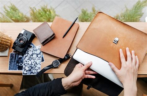 Hands taking something out of leather | Photo - rawpixel
