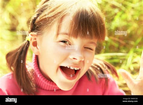 Portrait of cheerful girl Stock Photo - Alamy