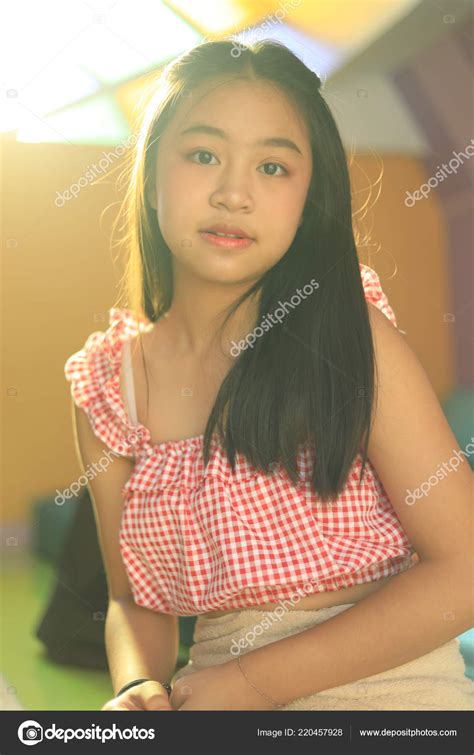 Portrait Young Asian Teenage Girl Stock Photo by ©nitimongkolchai 220457928