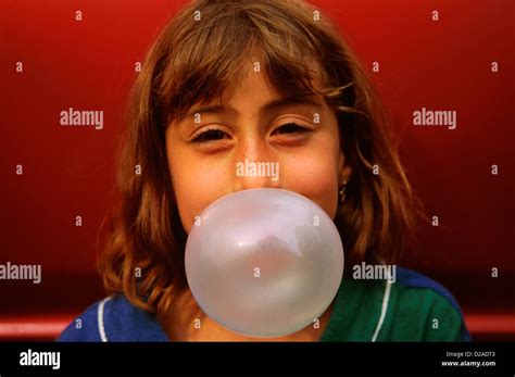 year  girl blowing bubble gum  res stock photography