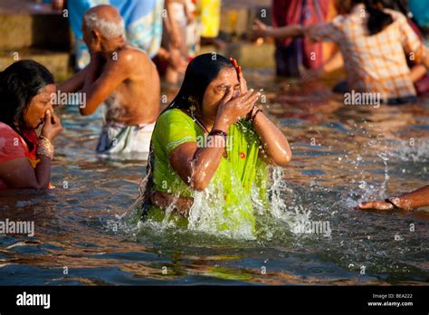 Hindu Woman Bathing in the Ganges River in Varanasi India Stock Photo ...