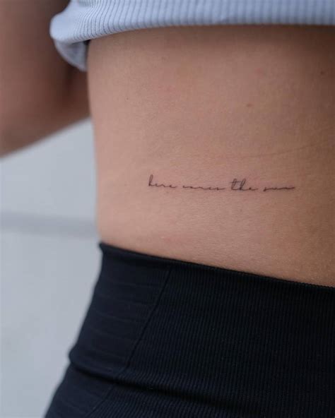 Tattoo that says "here comes the sun" handwritten on