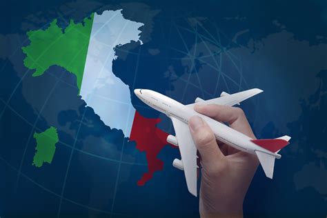 hand holding airplane with map of Italy. | WOW! Travel Club
