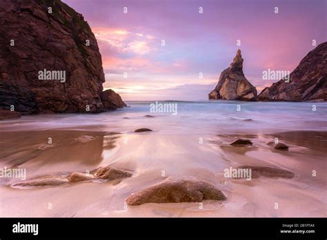 sunset   beach  praia da ursawith  giant ursa  gigante