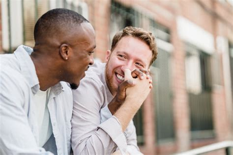 Close-up of Smiling Men Holding Hands · Free Stock Photo