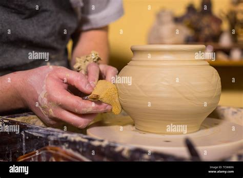 Professional potter shaping pot Stock Photo - Alamy