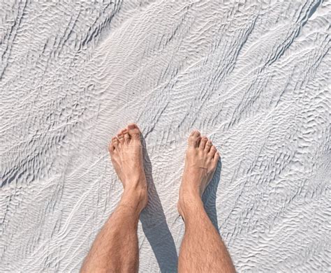 Man Feet on White Calcite Travertines with Mineral Water from Thermal Springs in Pamukkale ...