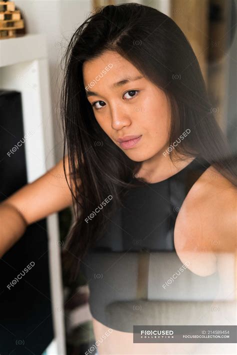 Young adult chinese woman looking at the camera — beautiful, asian