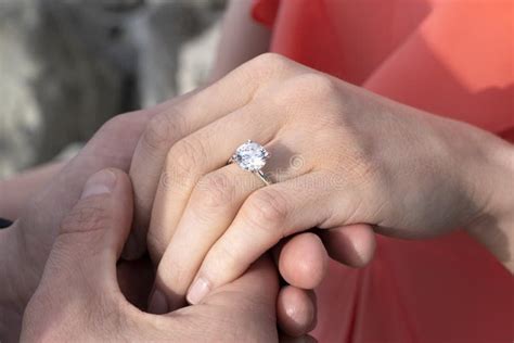 Closeup of Man`s Hand Holding a Woman`s Hand with Diamond Ring Stock ...