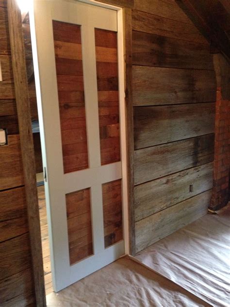 Pocket door made with reclaimed wood from the attic along with barn