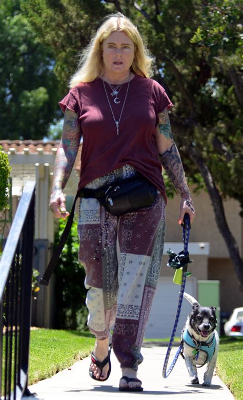 ‘Baywatch’ alum Erika Eleniak shows off edgy sleeve tattoos in rare outing