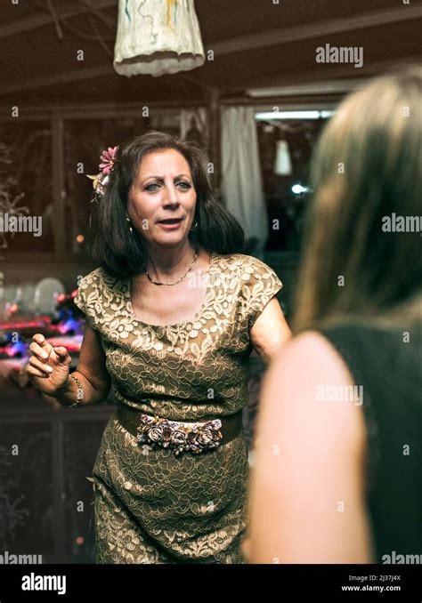 Mature woman dancing at party hi-res stock photography and images - Alamy