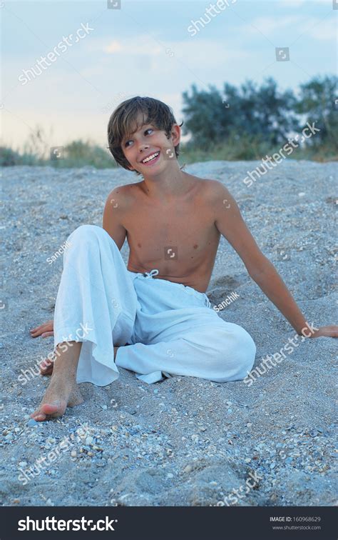 stokovaia fotografiia  evening  azov sea happy boy shutterstock