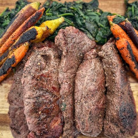 New York Strip Steaks with Baby Carrots and Spinach – Blackstone Products