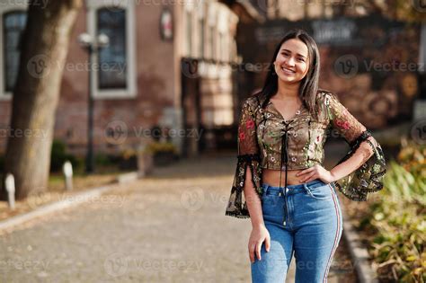 Pretty latino model girl from Ecuador wear on jeans posed at street