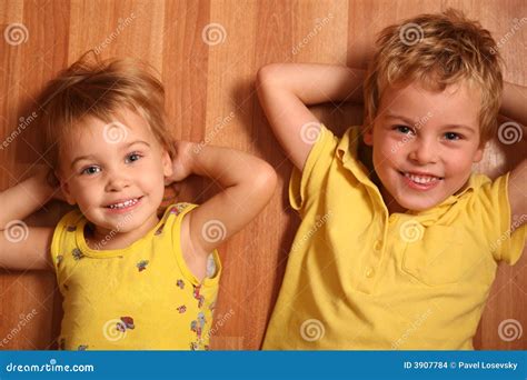 children lie  floor stock photo image  brother