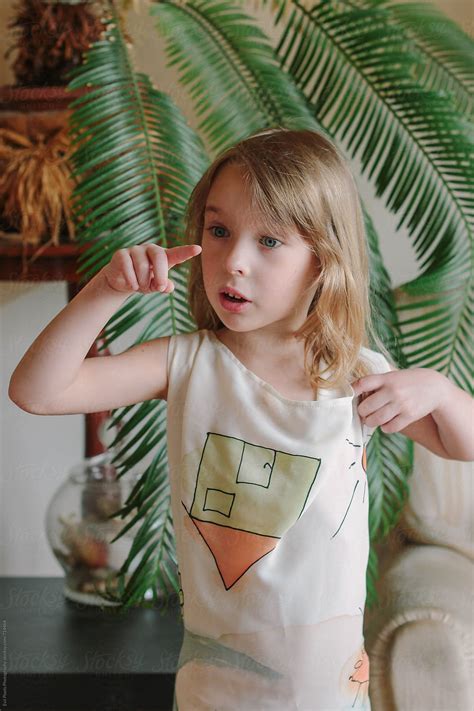 "Portrait Of A Cute Little Girl Having Fun At Her Home" by Stocksy