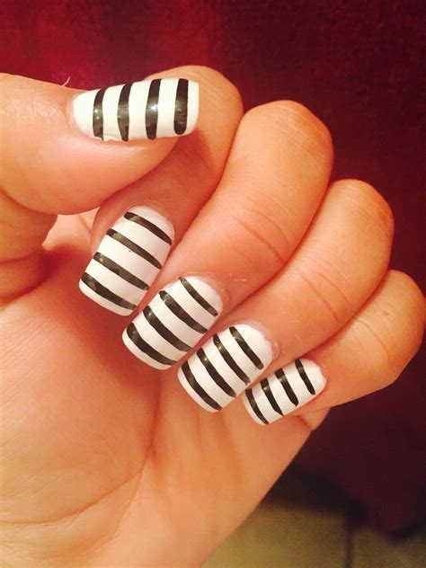 White nails with black stripes