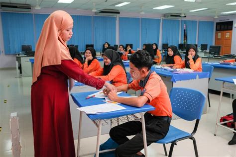 Muslim Teacher Smiling To Her Student Who Answer the Question Editorial ...