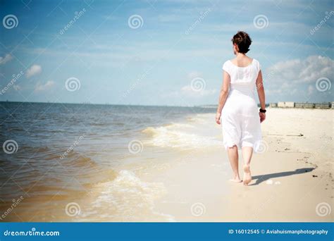 Pretty Woman Walking the Beach Stock Image - Image of adult, look: 16012545