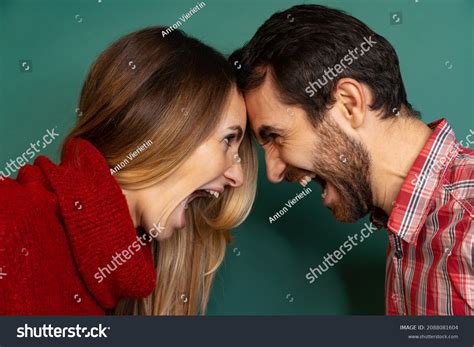 women bumping heads    royalty  licensable stock