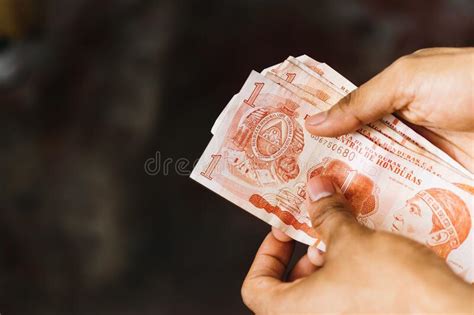 Selective Focus of Male Hands Holding Honduran Lempira in His Hands and ...