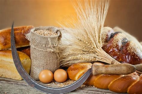 Premium Photo | Bread and wheat on a wooden background