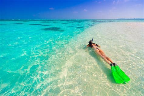 Maldives, women snorkeling stock photo. Image of blue - 75280240