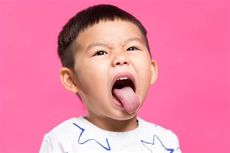 little boy sticking out tongue - Wyoming Department of Health