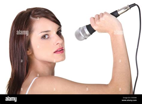 Girl singing with microphone Stock Photo - Alamy