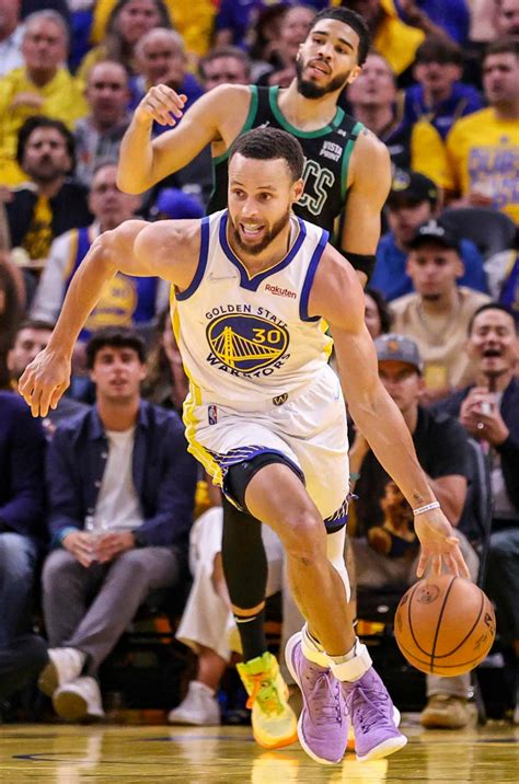 Download Steph Curry Dribbling A Ball During Game Wallpaper