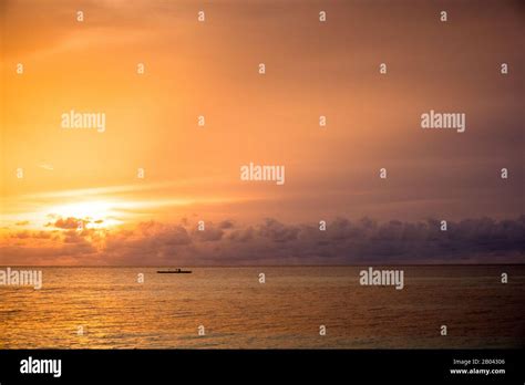 view of a sunset in a beach in maldives Stock Photo - Alamy