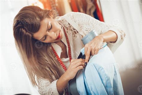 Young Woman Tailor 14067535 Stock Photo at Vecteezy