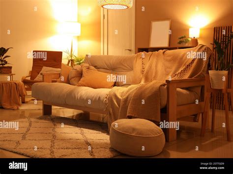comfortable sofa  glowing lamps  interior  living room stock